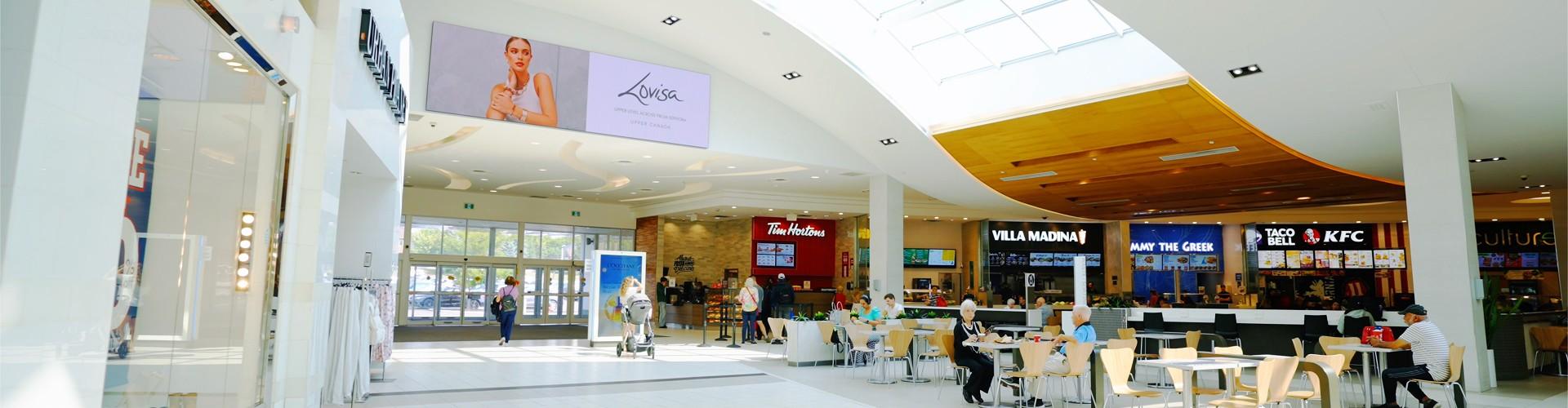 Bright mall food court with Tim Hortons, Villa Madina, Taco Bell and KFC