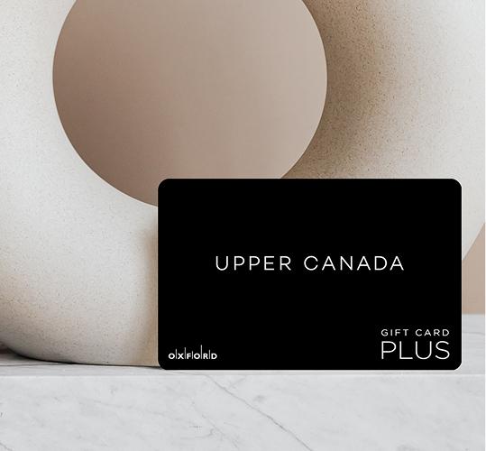 Black Upper Canada Plus gift card against a beige sculpture on marble