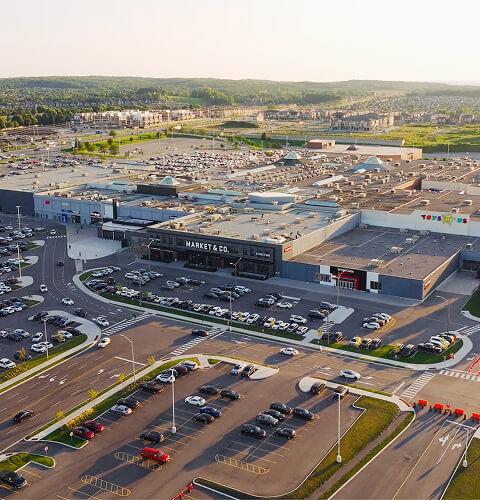 Aerial view of the Upper Canada mall with Market & Co. and Toys R Us at sunset