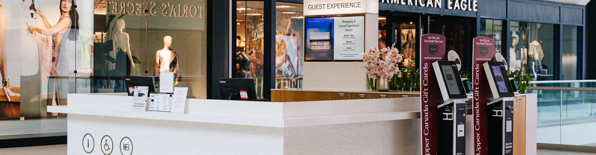 Upper Canada Guest Experience desk with gift card kiosks by American Eagle
