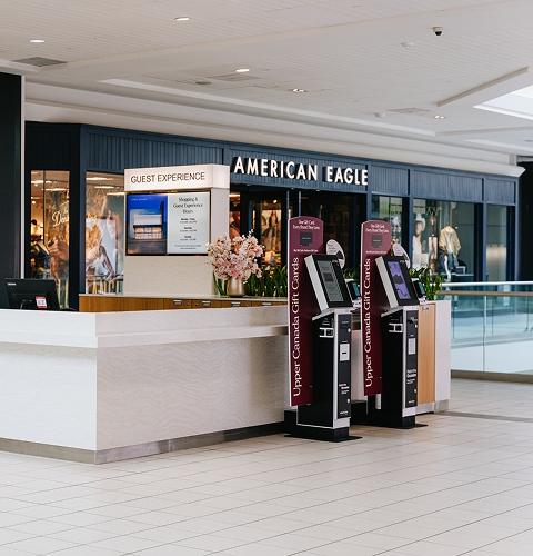 Upper Canada Guest Experience desk with gift card kiosks by American Eagle