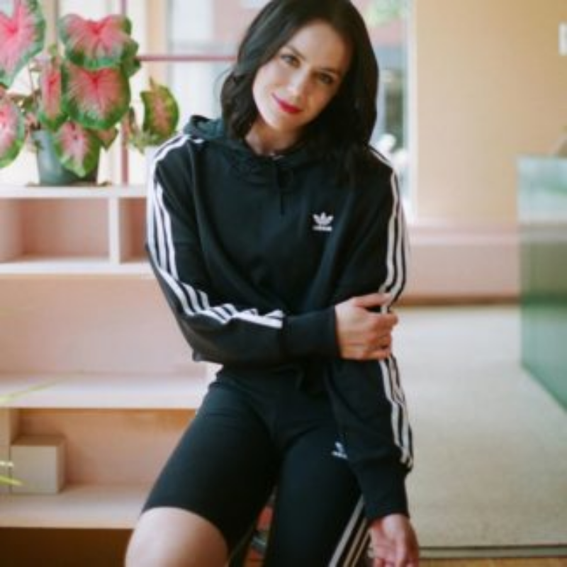 Woman wearing Adidas tracksuit