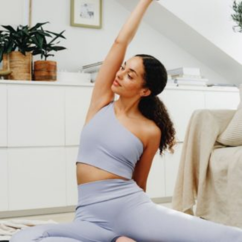 Woman in yoga post in light blue apparel