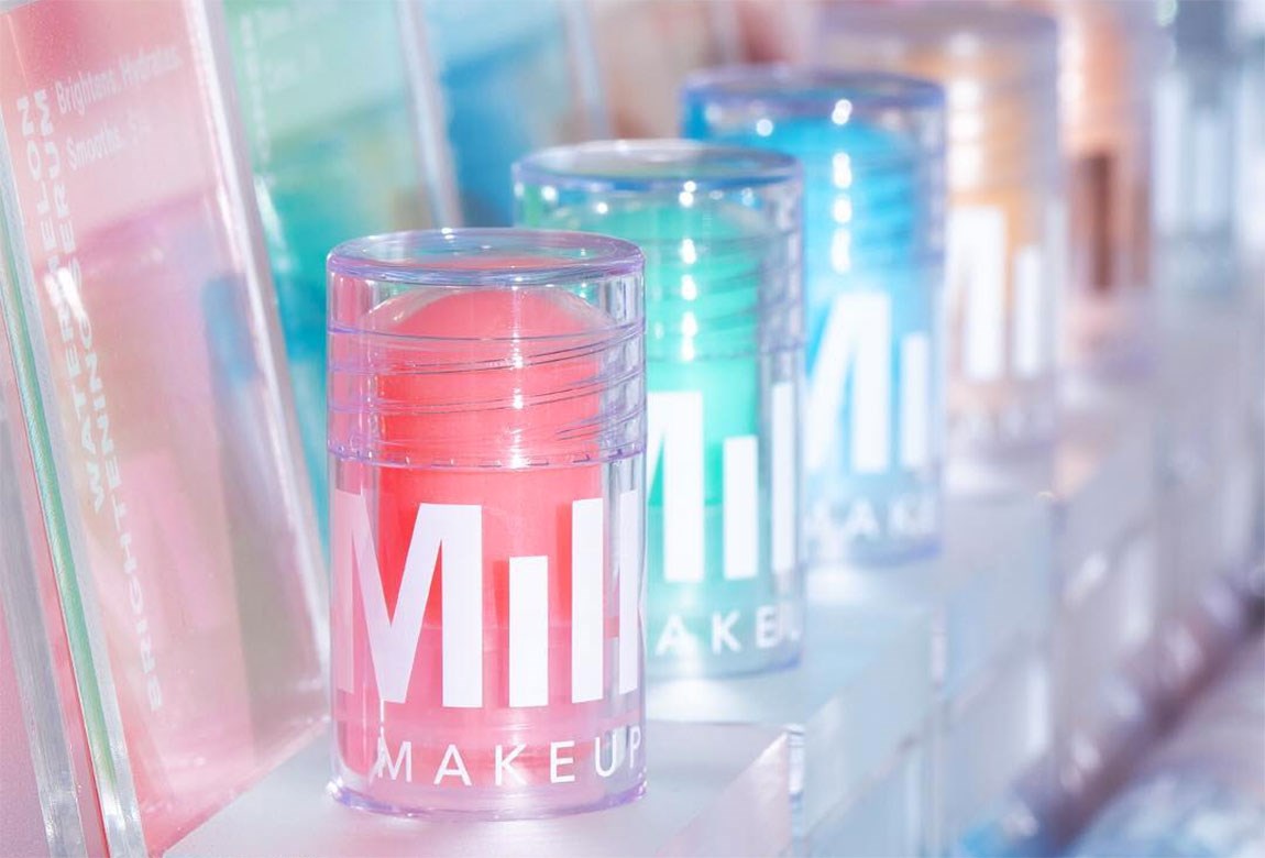 angled image of colourful Milk Makeup products lined up in a row.