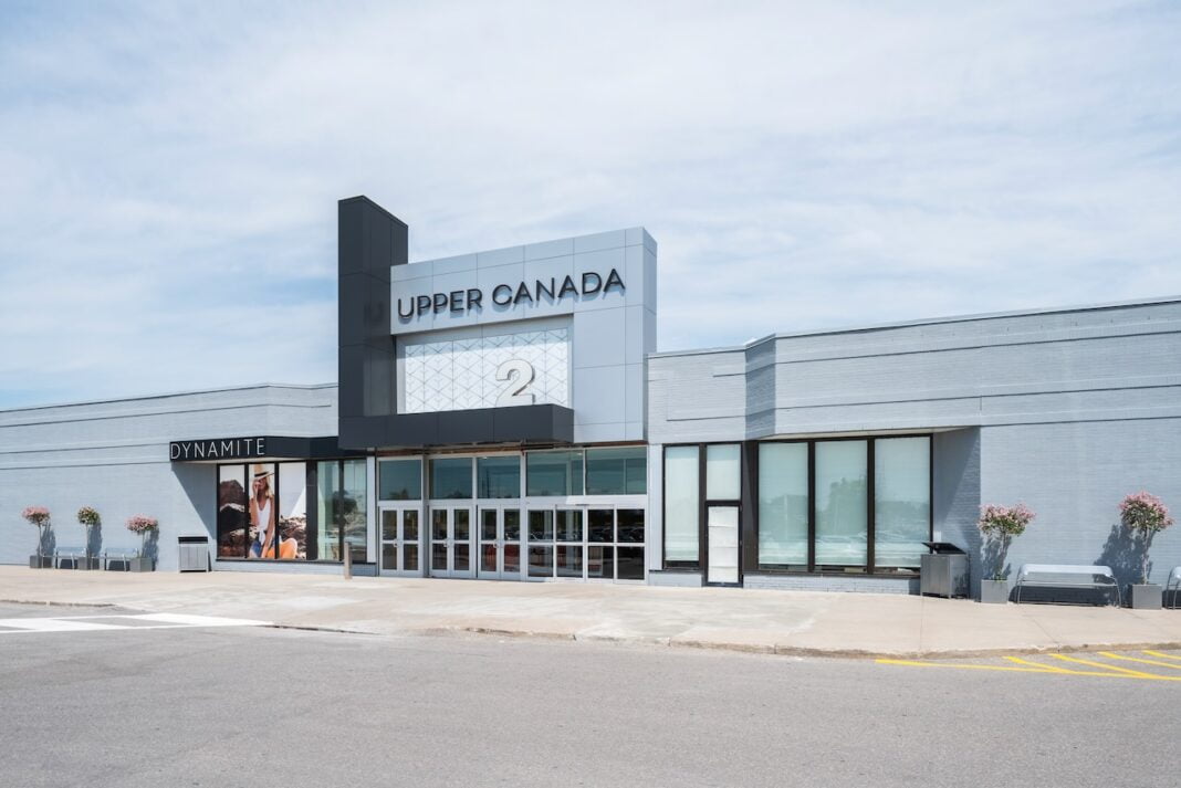 An exterior image of Upper Canada Mall on a slightly overcast day. A sign for the store Dynamite is visible.