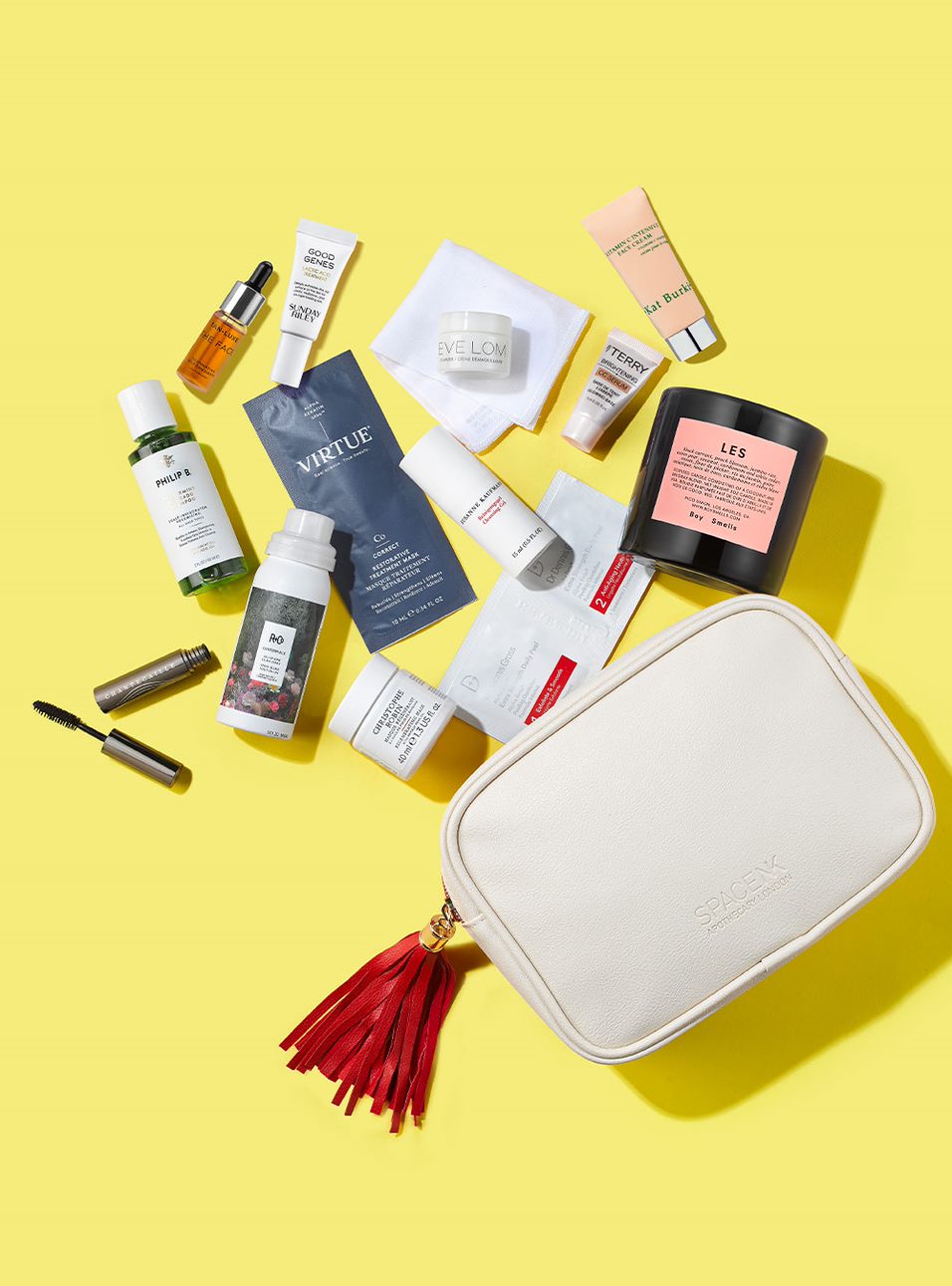 Flat lay of various beauty products coming out of a makeup bag