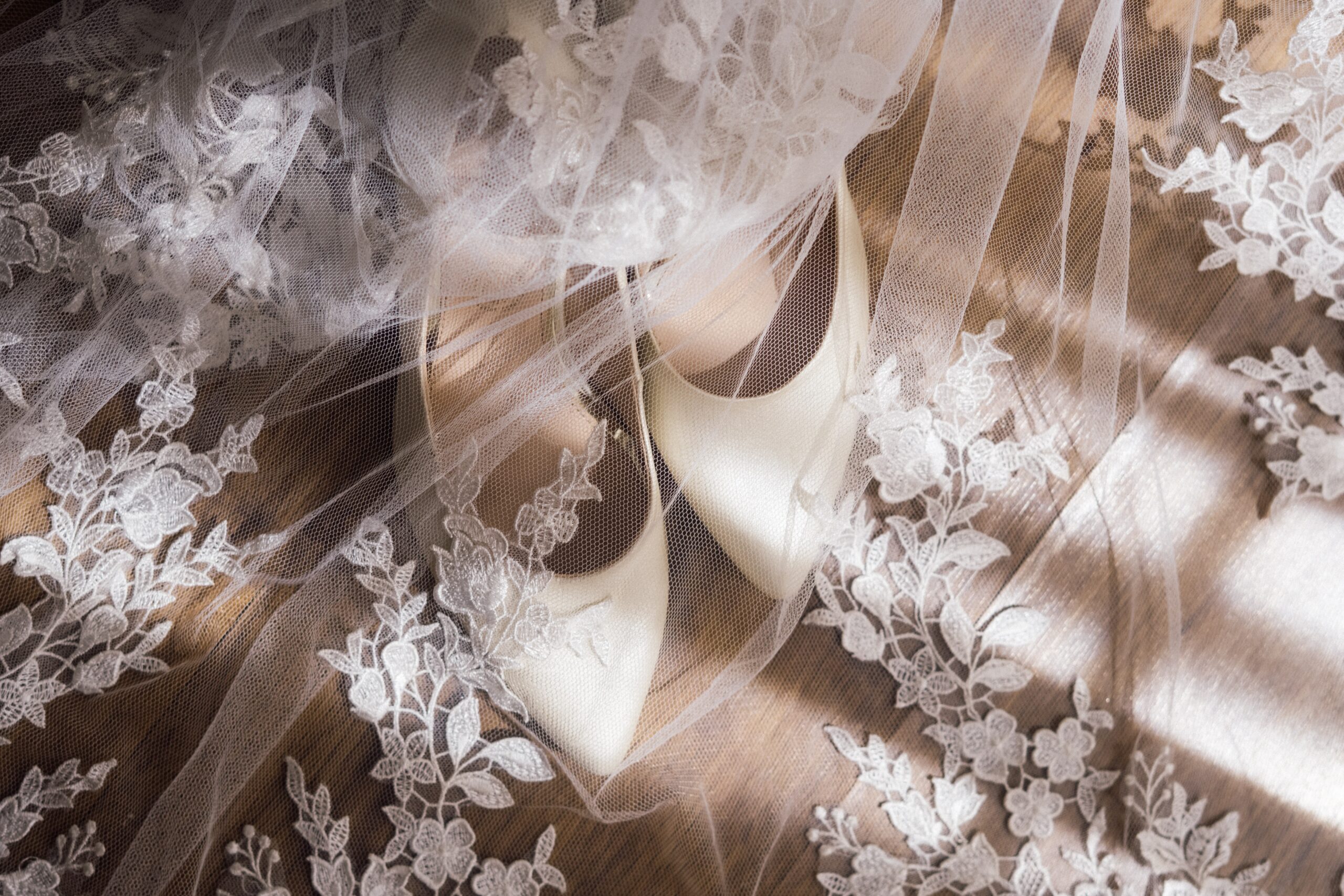 wedding shoes under a lace veil