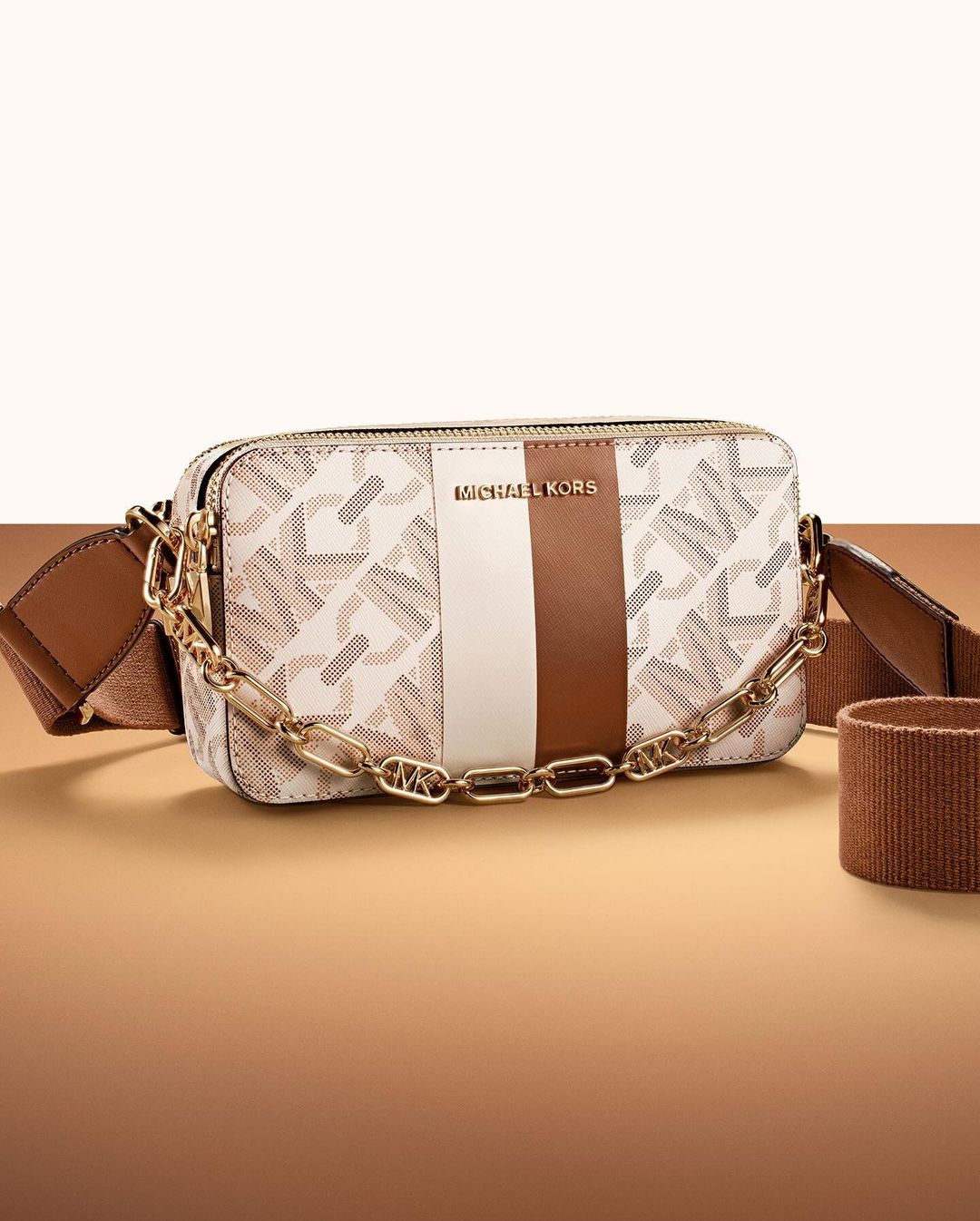 Brown and cream coloured crossbody purse.