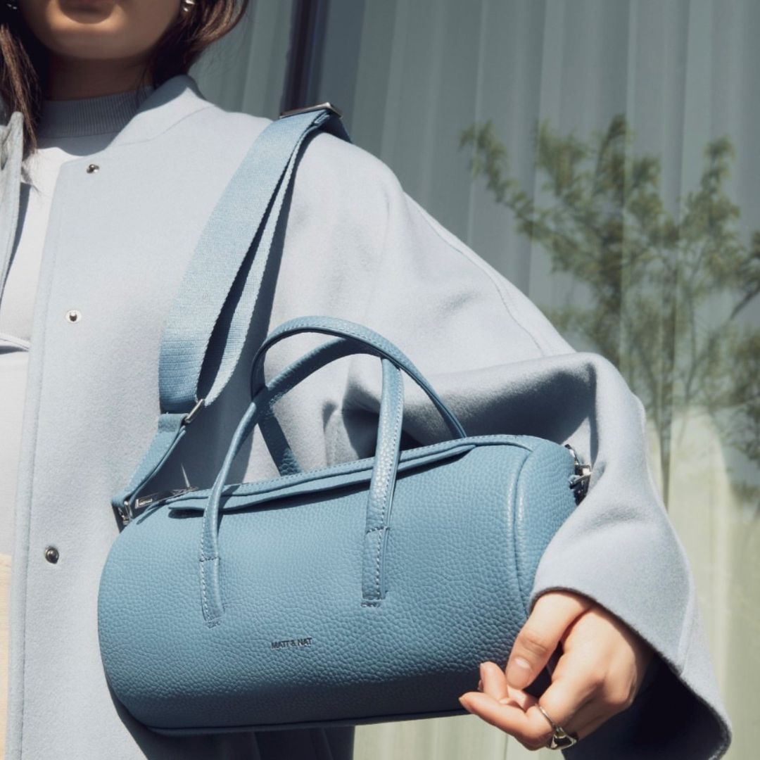 Small blue duffle bag as purse