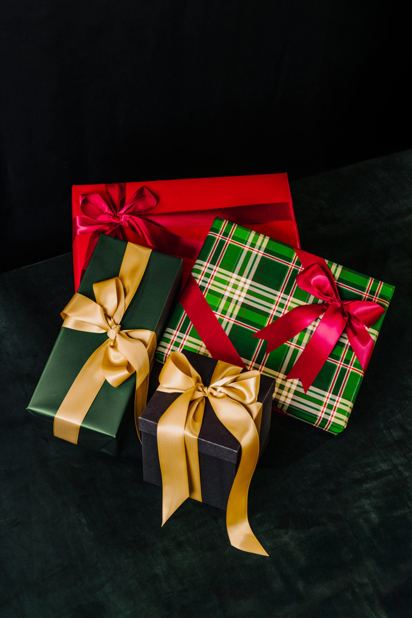 Wrapped gifts in Green, red and gold with Bows