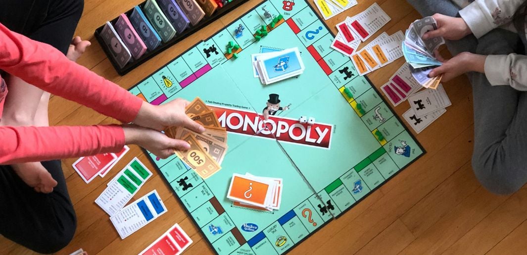 kids playing monopoly